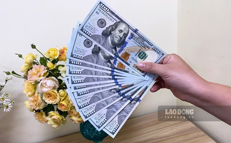 Dong USD suy yeu so voi nhieu dong tien chu chot khi ky vong dat duoc thoa thuan thuong mai My - Trung khien gioi dau tu giam nhu cau nam giu tai san an toan. Anh: Tra My