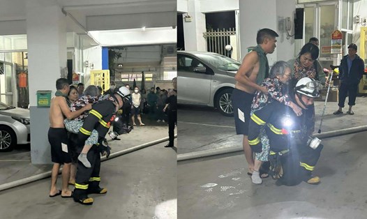 Lực lượng chức năng kịp thời giải cứu 2 người dân trong vụ cháy căn hộ tầng 4 của chung cư 15B Đông Quan. Ảnh: Công an Hà Nội