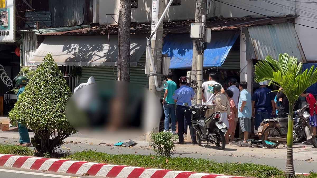 The scene of a car hitting a motorbike and crashing into a house, killing 1 person in Ho Chi Minh City. Photo: Dinh Trong