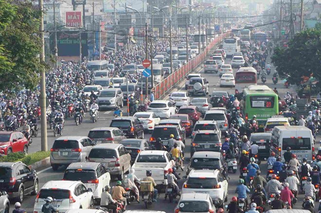 Ciudad Ho Chi Minh ampliara la Carretera Nacional 13 a 60 m combinada con una carretera elevada de 4 carriles. Foto: Minh Quan