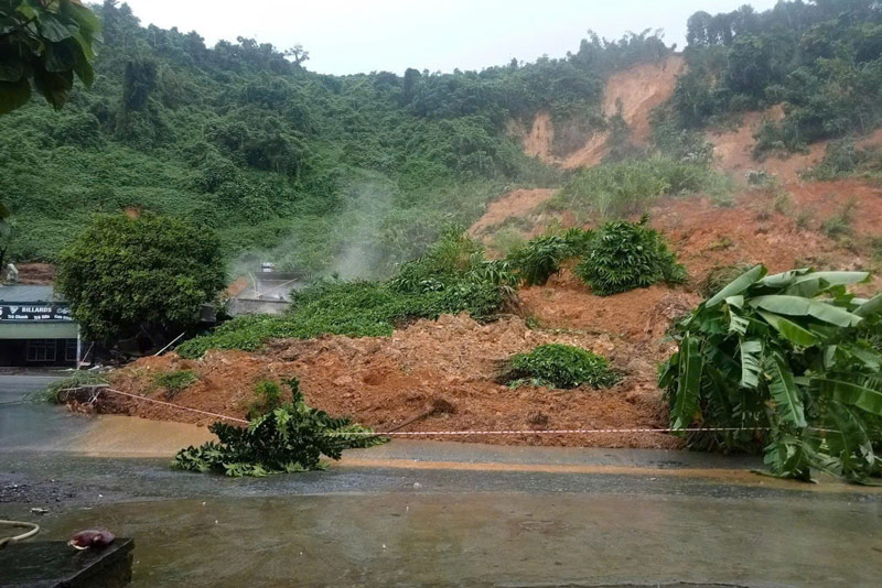 Soil and rocks buried houses, a section of National Highway 70 through Lao Cai province. Photo: Provided by the people