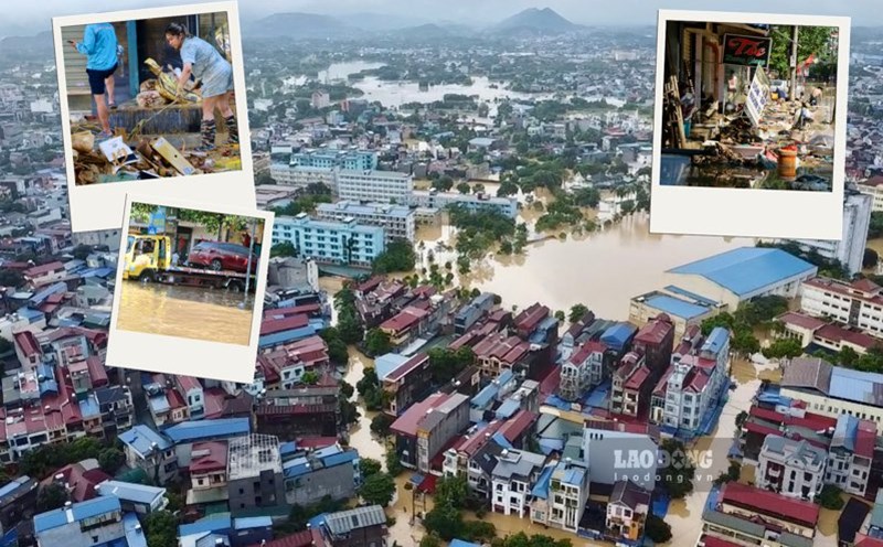 People are busy cleaning up after the historic flood. Photo: Nguyen Hoan.