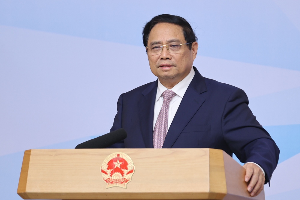 Politburo member and Prime Minister Pham Minh Chinh delivered a concluding speech at the conference on the establishment of an international financial center in Vietnam. Photo: VGP/Nhat Bac