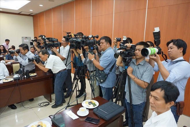 Reporters working at an event held in Ho Chi Minh City. Photo: Minh Quan