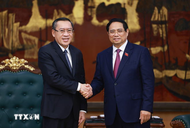 Politburo member and Prime Minister Pham Minh Chinh received Mr. Phosay Sayasone, Minister of Labor and Social Welfare of Laos. Photo: VNA