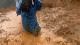 The authorities wade through deep mud and landslides to reach isolated people in Da Nang. Photo: Tran Thi