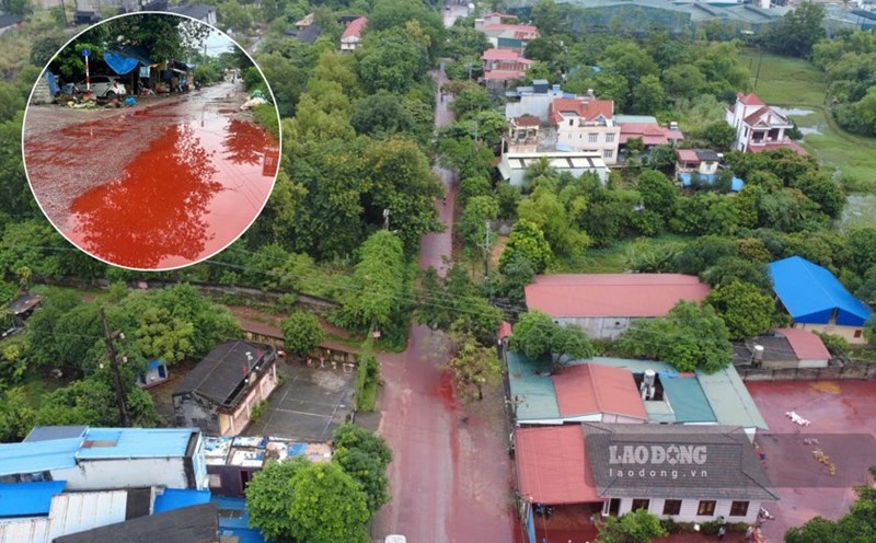 Red oil suspected of overflowing ore covers the road surface in Thai Nguyen. Photo: Dang Vu.