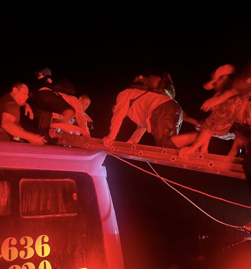 Authorities in Khanh Hoa have just rescued 33 people on a bus swept away by floodwaters. Photo: Provided by the police