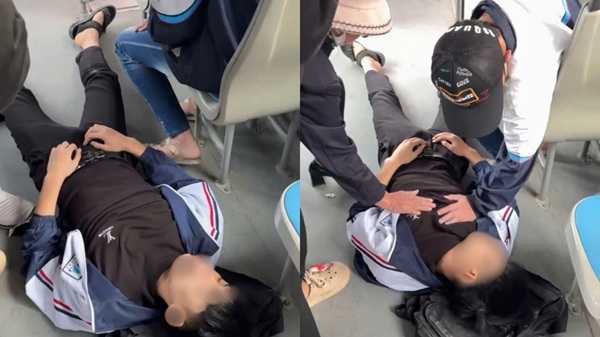 ハノイのバス職員が、気を失った生徒を救急搬送しました。写真:Transerco