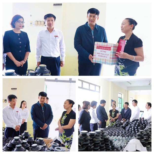 Doan cong tac do Tong Giam doc Pham Toan Vuong dan dau toi tham hoi, dong vien khach hang cua Agribank bi thiet hai do bao lu. Anh: Agribank