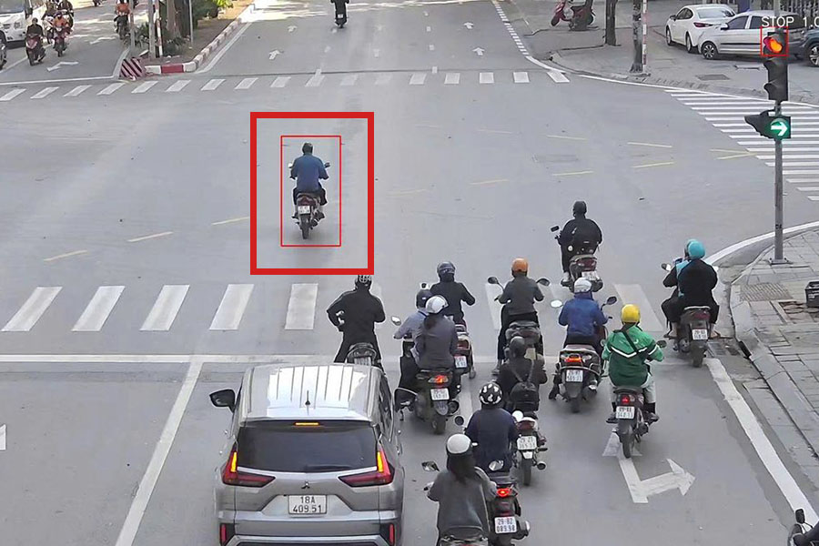 AI camera images show motorbike drivers running red lights. Photo: Traffic Police Department