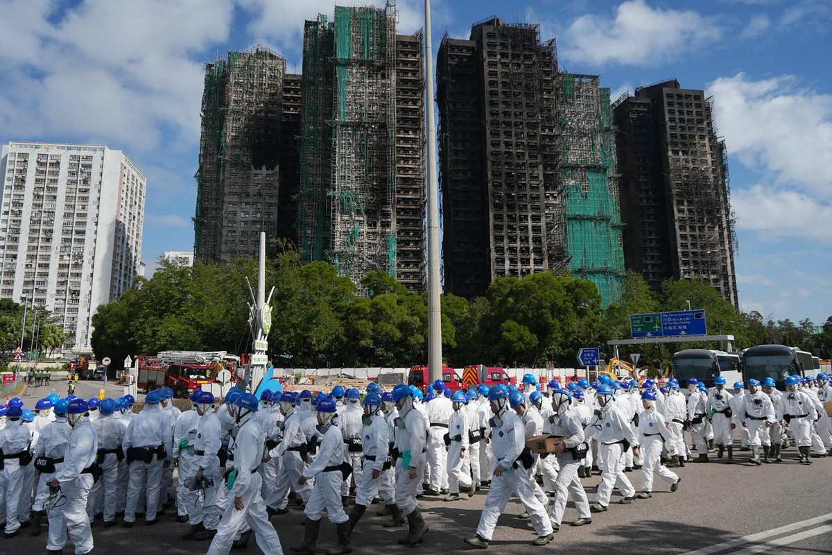 The Department of Natural Disaster victims identification (DVIU) is on duty at the scene of the Wang Fuk Court apartment fire, November 29, 2025. Photo: AFP
