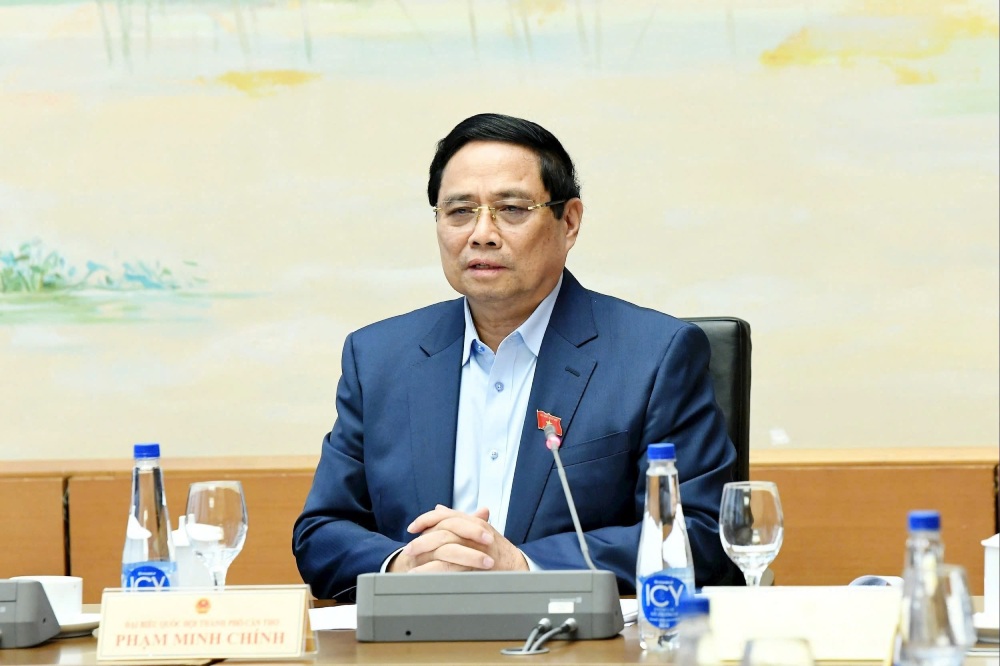 Politburo member and Prime Minister Pham Minh Chinh talked about building job positions and arranging suitable staff for local authorities at both levels. Photo: Pham Dong