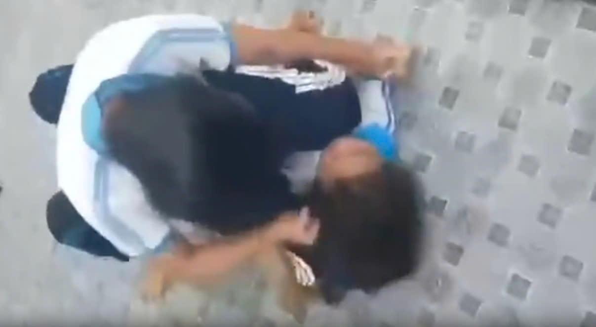 Female students fight in the toilet at school. Photo cut from a clip provided by a reader