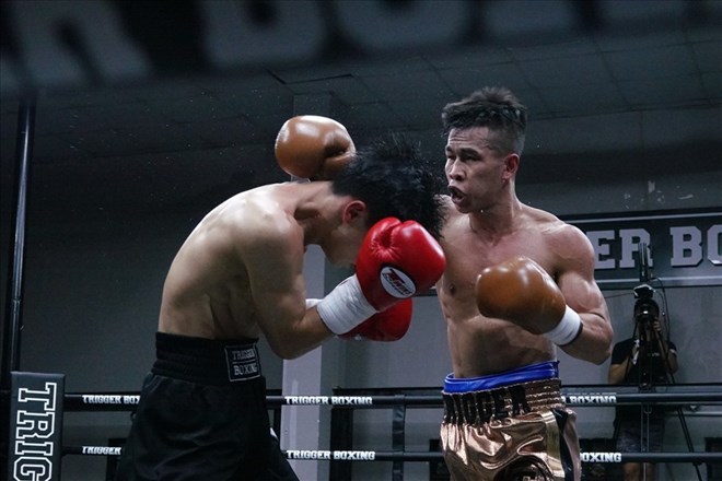 Tran Van Thao (right) is one of the most famous boxers in Vietnam. Photo: Nguyen Dang