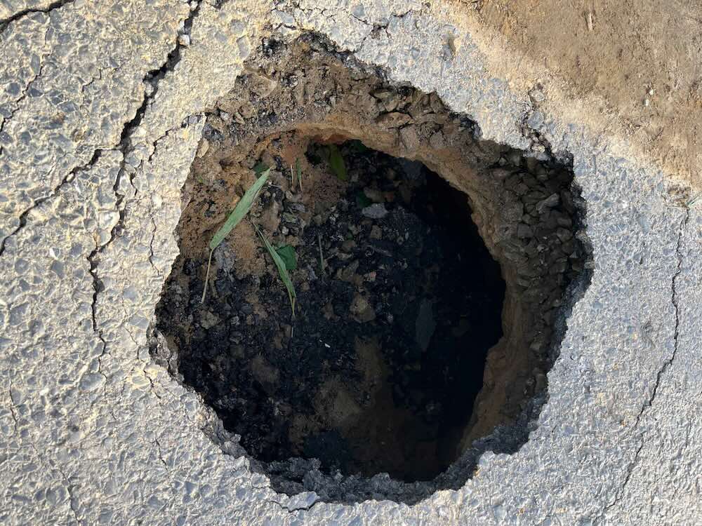 The sinkhole appeared on National Highway 49. Photo: Dung Lai