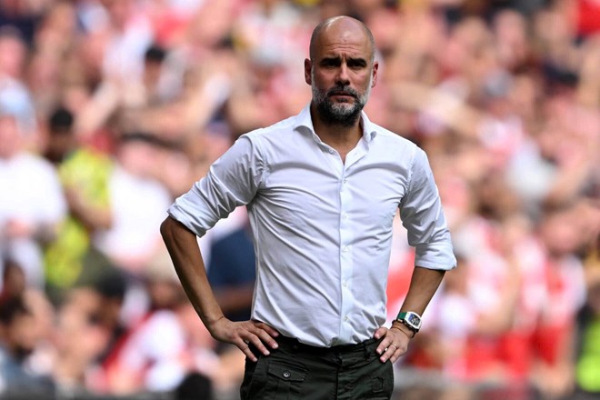 Guardiola is confident that Man City will soon take Arsenal's top spot. Photo: AFP