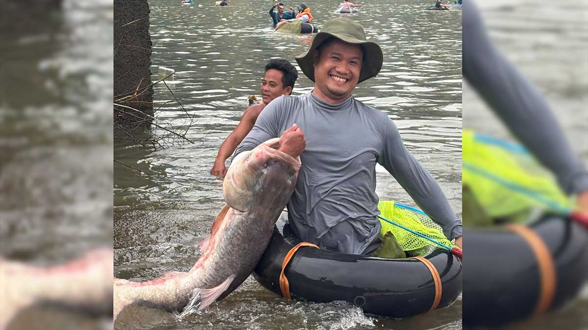 Many people are excited to hunt for giant fish at the foot of the Tri An Hydroelectric Reservoir Dam. Photo: HAC