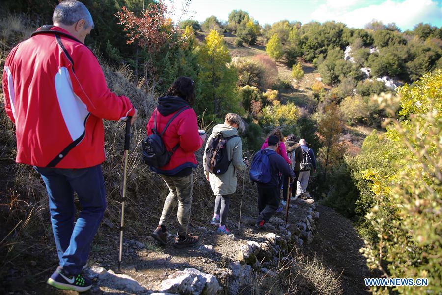 Greek tourists from Greece explore the trail near Vytina, Arcadia - a famous mountainous area of the Peloponnese peninsula with pine forests, cool climate and poetic trails. Photo: Xinhua