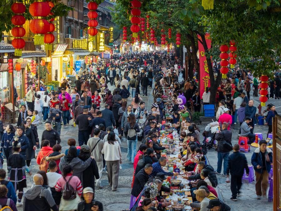 Tourists visit and experience the New Year festival in Guizhou province, southwestern China.