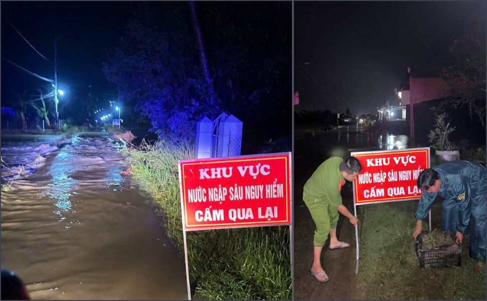 Cong an xa Phu My Dong cam bien canh bao tai cac duong tran bi ngap nuoc. Anh: Cong an