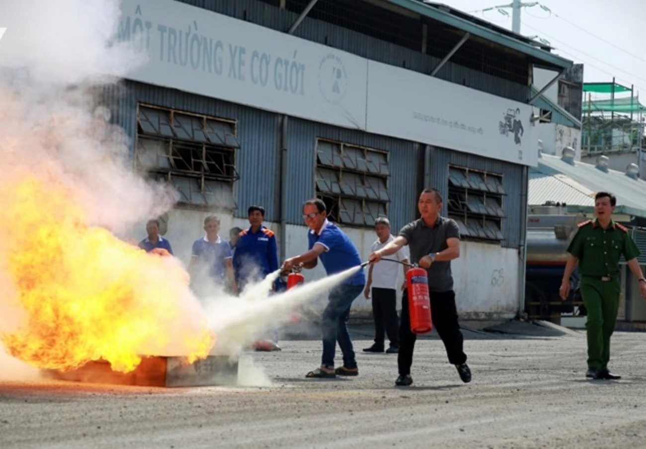 tank truck drivers in Ho Chi Minh City practice extinguishing a simulated fire caused by gasoline. Photo: Minh Quan