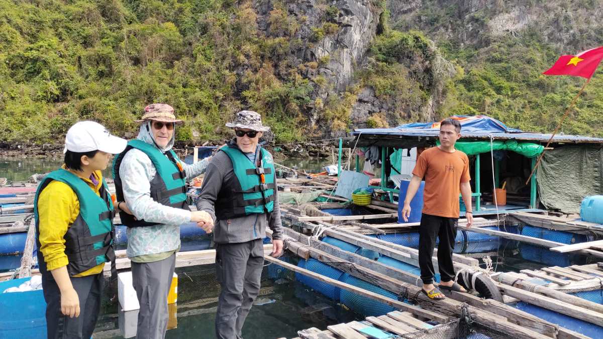 Two American millionaire tourists visit Vung Vieng fishing village, Ha Long Bay. Photo: Nguyen Hung