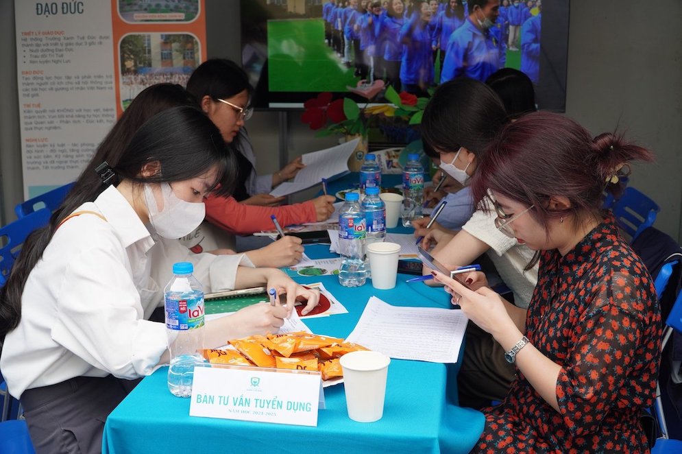 Students seek information at a job fair organized by Hanoi National University of Education. Photo: Van Trang