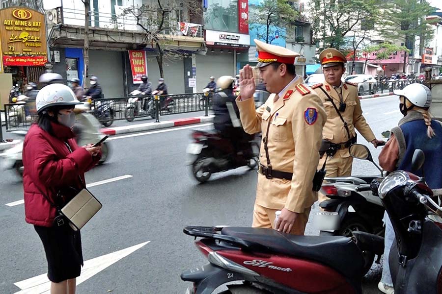 Going in the wrong direction on Ton Duc Thang street and then lining up to pay a fine