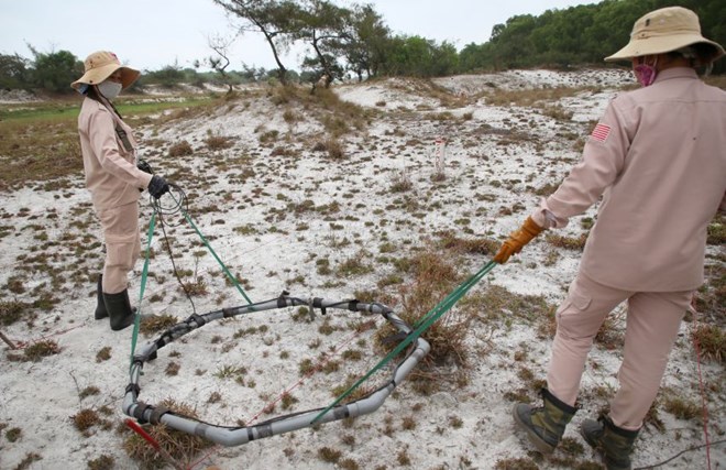 Mine clearance staff in Quang Tri province searched for explosive materials left after the war. Photo: Hung Tho