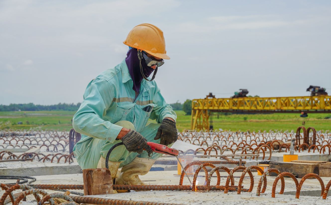 Workers constructing the expressway section through Soc Trang province