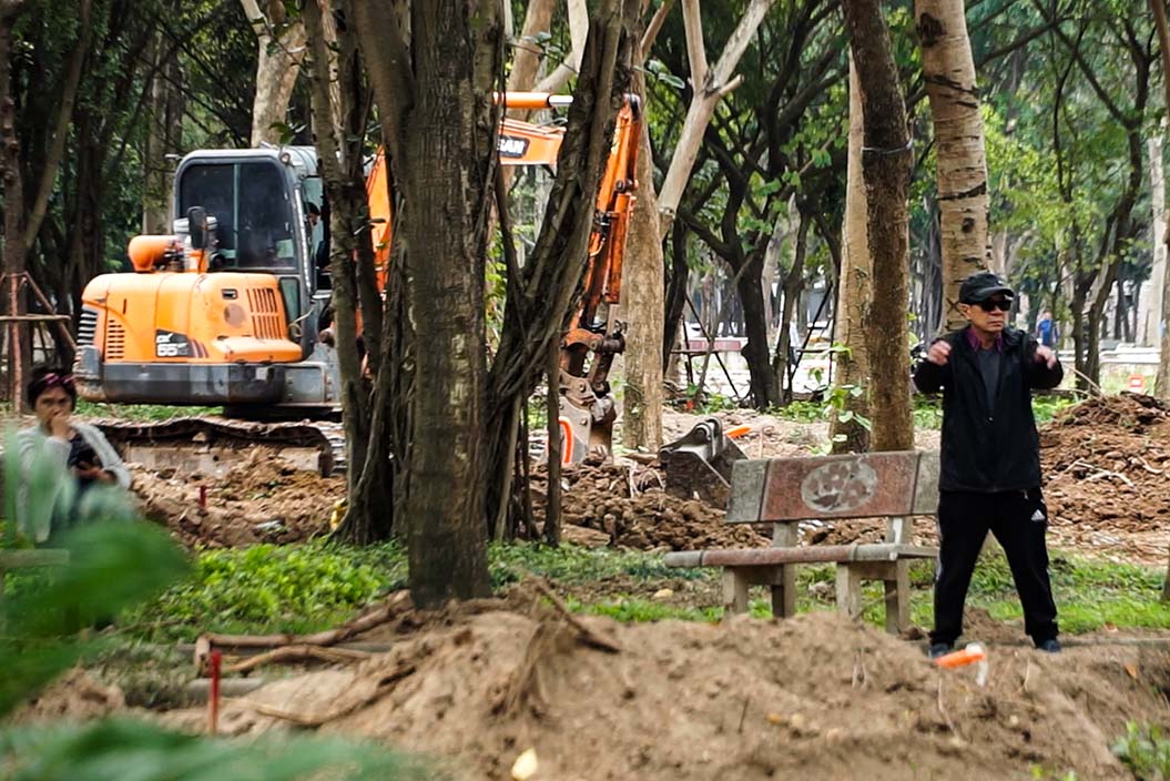 People exercise in the park renovation site. Photo: Huu Vu
