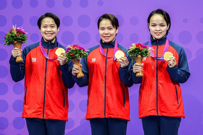 Athletes won the karate gold medal in the women's team kata event at the 19th ASIAD. Photo: Bui Luong