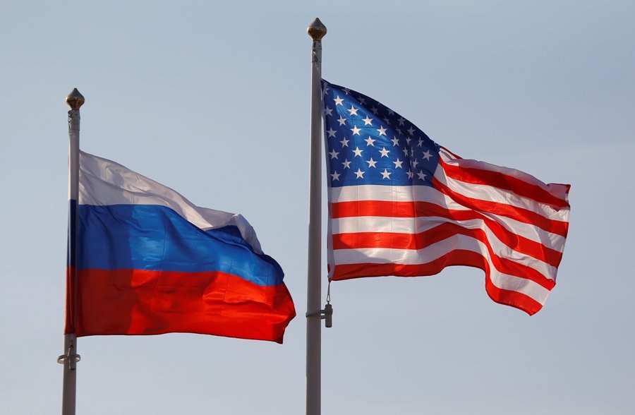 Russian flag (left) and US flag at Vnukovo International Airport, Moscow, Russia, April 11, 2017. Photo: Xinhua