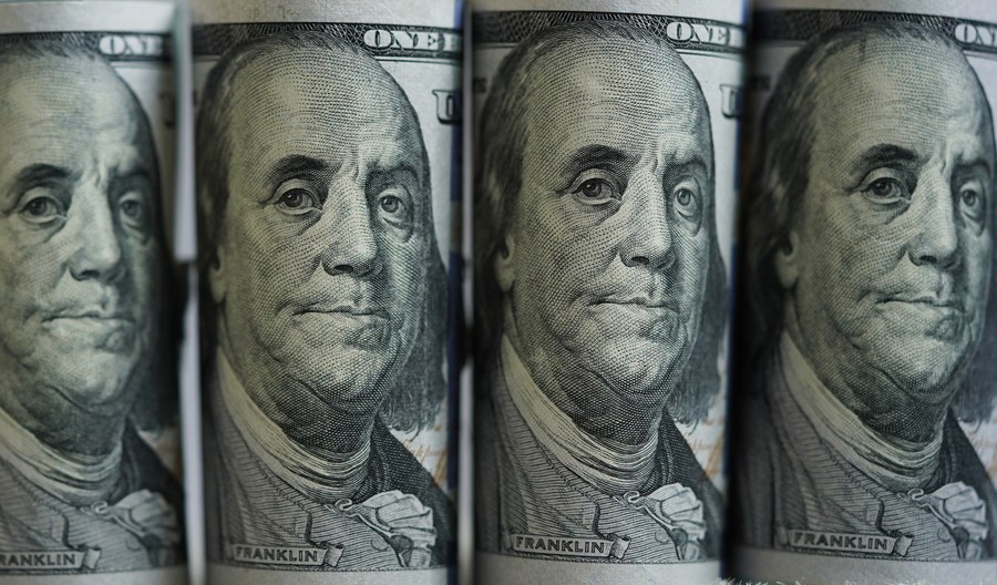 USD prices are trending down. Photo: Xinhua