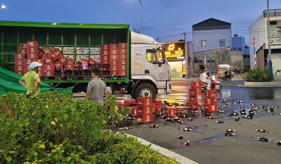 Hundreds of beer bins fell onto the road.