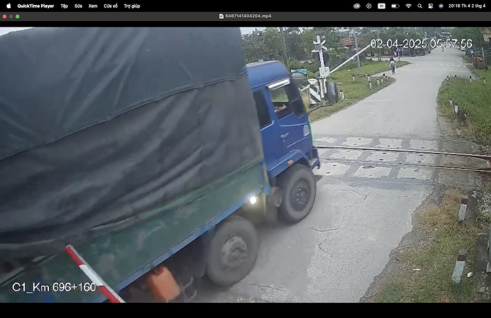 Driver crosses railway barrier in Hue.