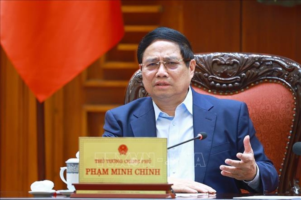Politburo member and Prime Minister Pham Minh Chinh chaired a meeting on US counterpart tariffs. Photo: VNA