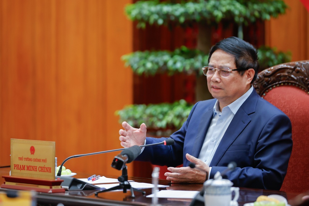Politburo member and Prime Minister Pham Minh Chinh chaired a meeting on the new US tax rate. Photo: VGP