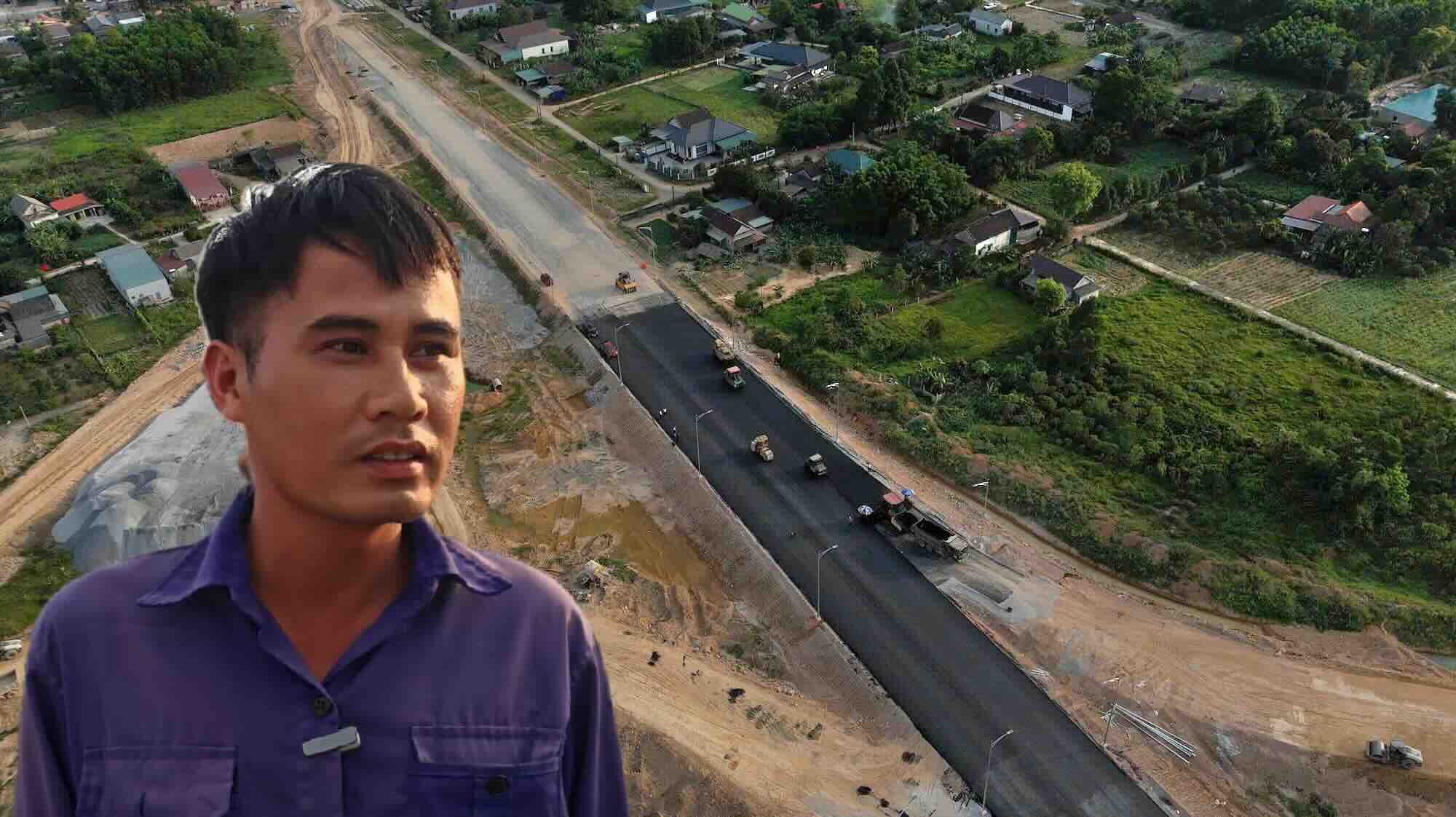 Los trabajadores trabajan durante la Misa en la autopista de Van Ninh-Cam Lo.