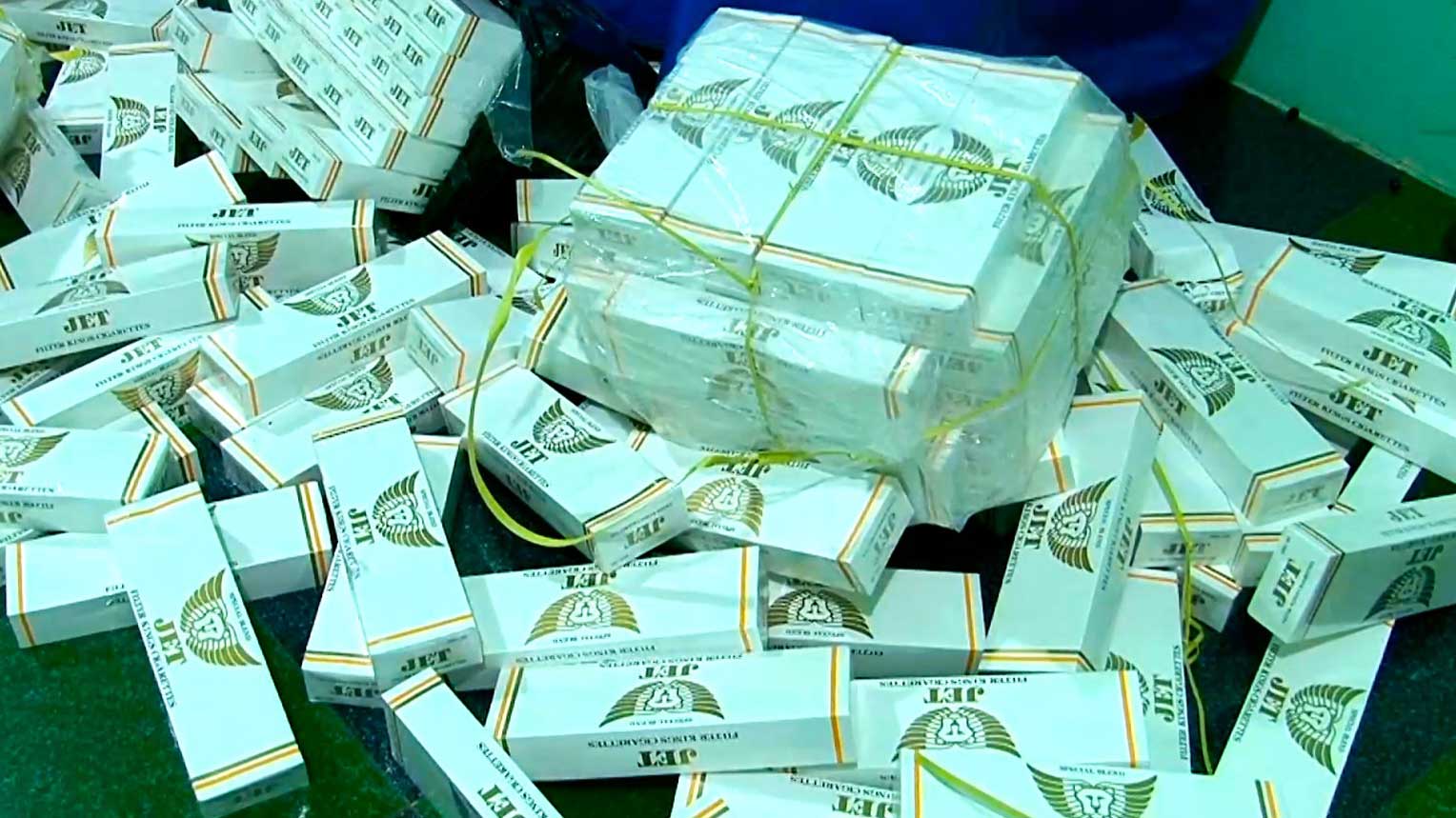 The police discovered and seized nearly 13,000 packs of smuggled cigarettes at the subjects' residences.