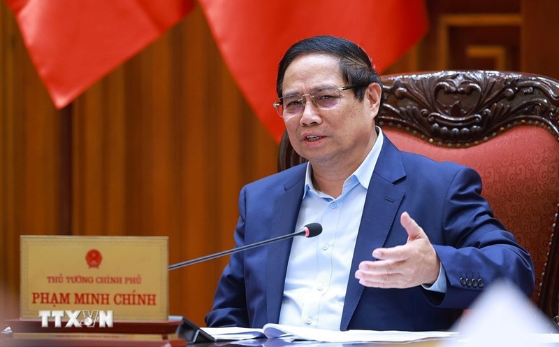 Politburo member and Prime Minister Pham Minh Chinh chaired a meeting on the US imposing counterpart tariffs on Vietnamese goods. Photo: VGP