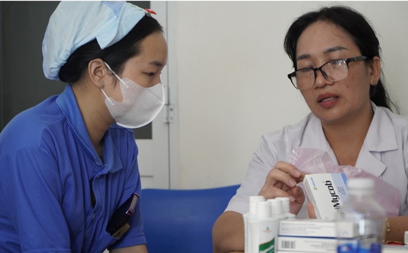 Medical examination and free medicine distribution to female workers.