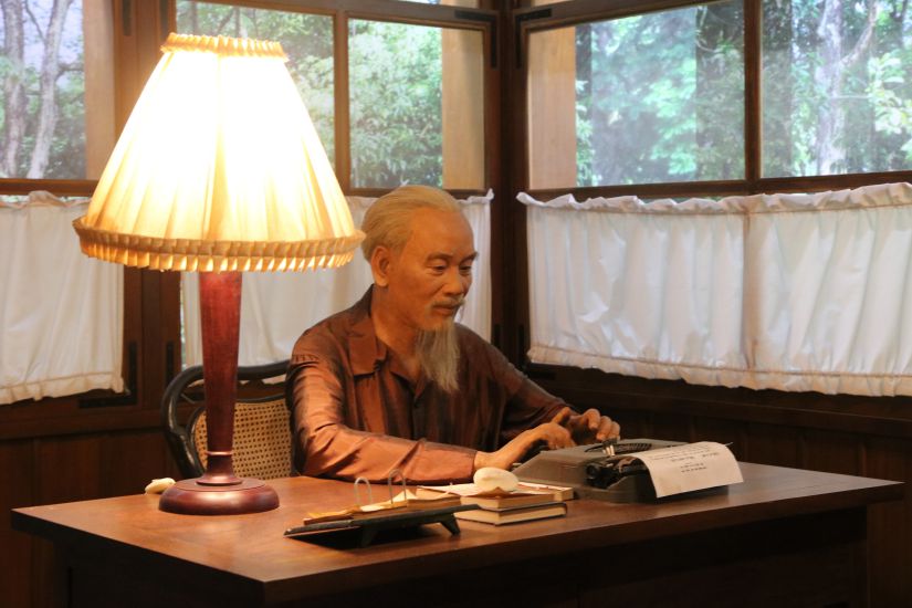 The statue of Uncle Ho sitting at work at the Ho Chi Minh Museum. Photo: Tran Vuong