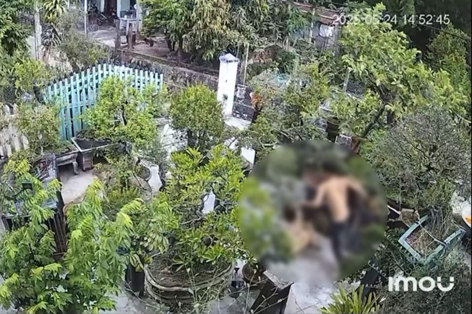 Scene of the husband brutally beating his wife in the garden. Photo cut from clip