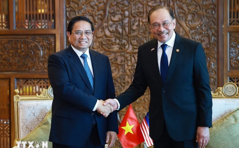 Politburo member, Prime Minister Pham Minh Chinh and Malaysian Prime Minister Anwar Ibrahim. Photo: VNA
