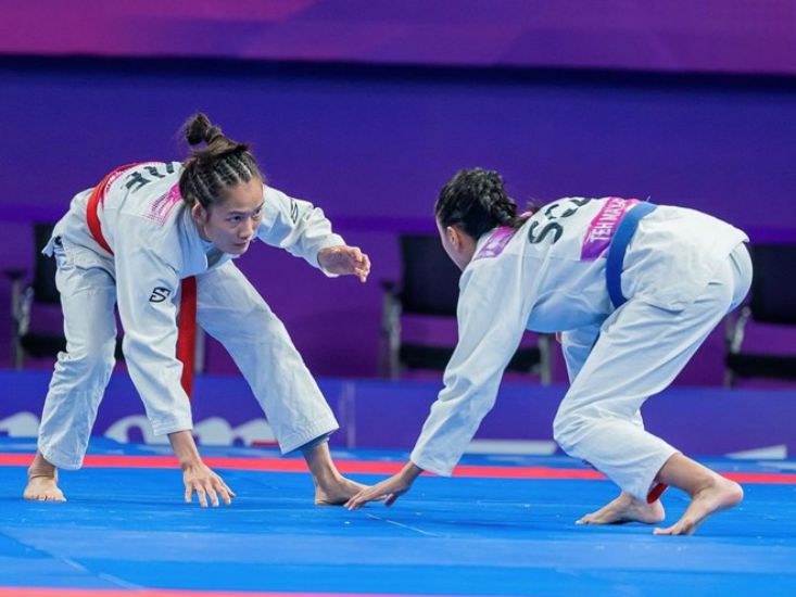 Luchador Phung Thi Hue (cinturon rojo) en Asiad 19. Foto: TTVN Delegacion