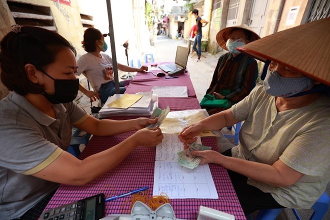 La gente de Hanoi recibe pensiones y subsidios de jubilacion. Foto: Hai Nguyen