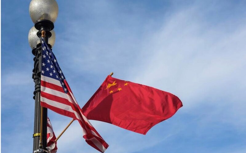 Chinese and US flags. Photo: Xinhua
