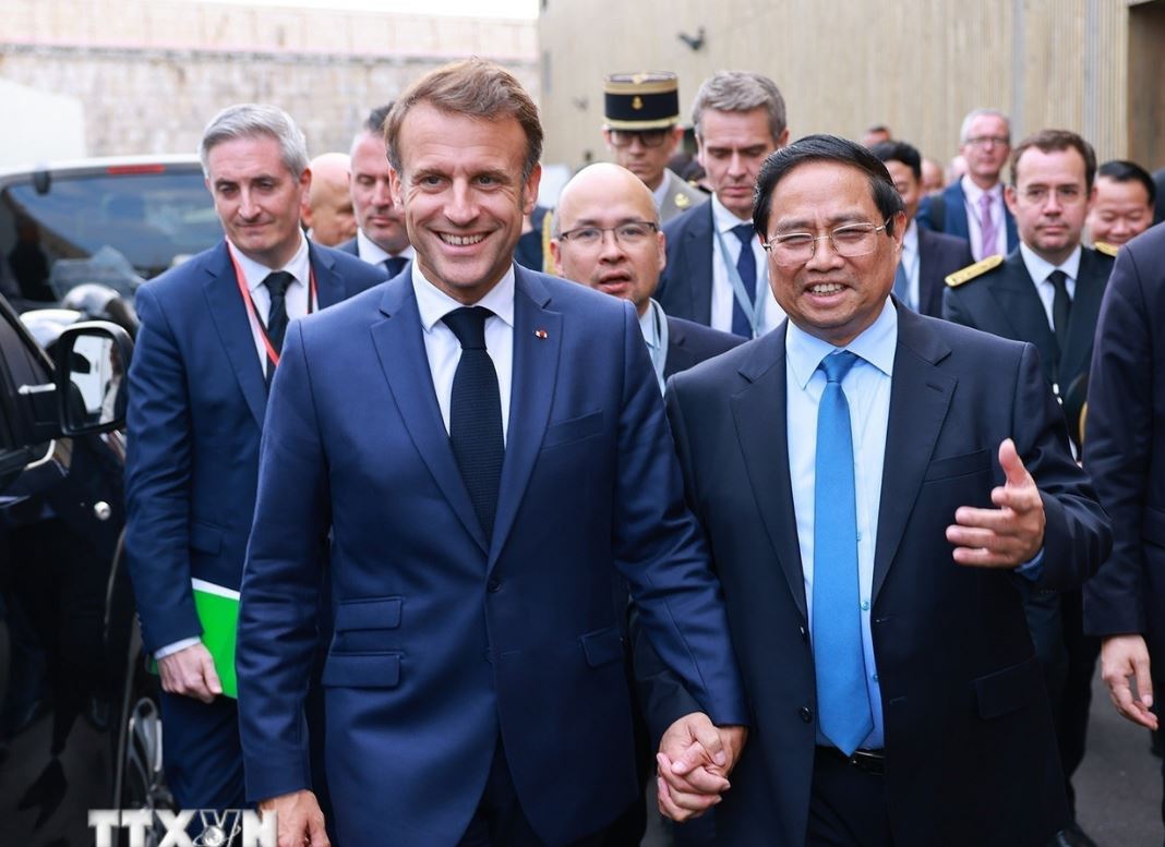 Politburo member, Prime Minister Pham Minh Chinh and French President Emmanuel Macron. Photo: VNA